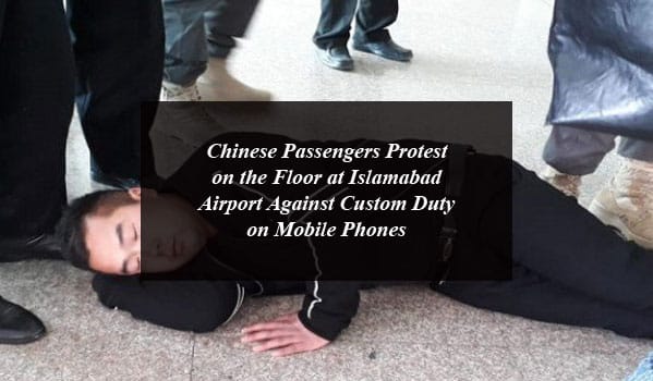 Chinese Passengers Protest on the Floor at Islamabad Airport Against Custom Duty on Mobile Phones